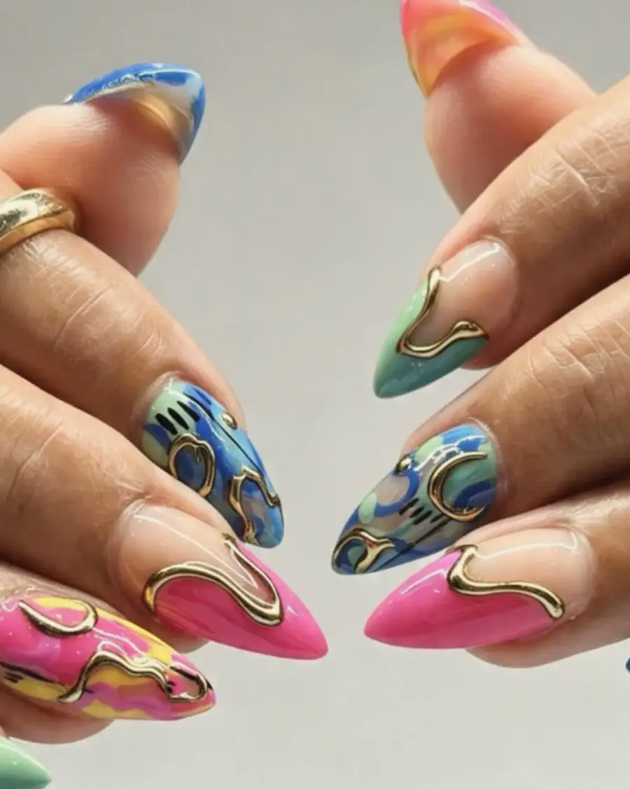 Almond nails in pink, blue and green with raised gold chrome swirls